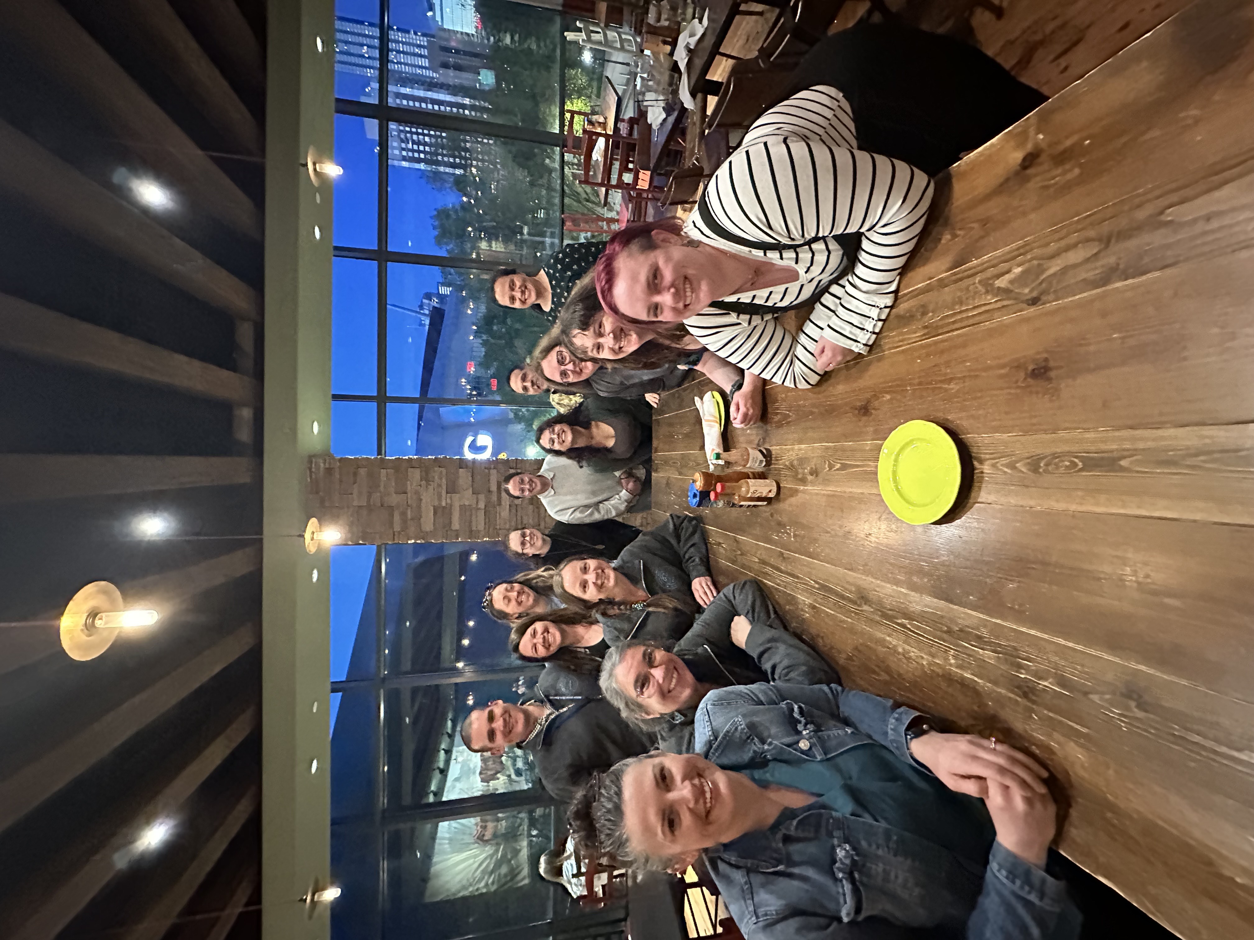 Group image of teams around a dinner table